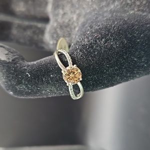 H-6 Silvertone ring with yellow solitaire and clear accents